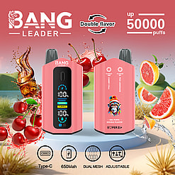 Two pink Bang Leader vape devices on a pedestal with cherries, cola splash, and grapefruit slices in the background, highlighting double flavor of cherry cola and pink lemonade, 50,000 puffs, type-C charging, 650mAh battery, dual mesh, and adjustable settings.