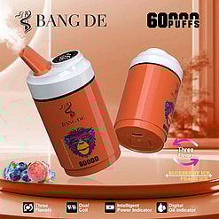 Two orange disposable vape devices with white tops and digital displays, branded with BANG DE, advertised for 60,000 puffs and available in three flavors including blueberry ice and peach ice, with images of blueberries and peaches beside them.