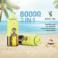 Two yellow disposable vape devices with cartoon monkey designs on a sandy beach with palm trees, next to text describing 80,000 puffs, 3 in 1 capacity, and details of 20ml x 3 e-liquid and 650mAh battery.