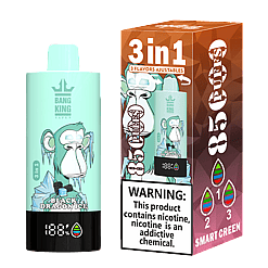 Mint green vape device with illustration of an icy monkey and text 'Black Dragon Ice', next to its brown and purple packaging box showing the same image, labeled '3 in 1', '85 Puffs', and nicotine warning.