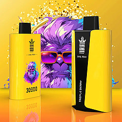 Two yellow and black Bang King 30K Pro vape devices with a colorful gorilla wearing orange sunglasses graphic in the background on a yellow surface with reflective sheen.