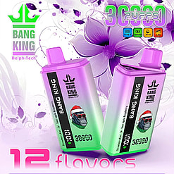 Two Bang King DelphiTech disposable vape devices in pink and green gradient colors with a gorilla wearing a Santa hat on each, positioned against a purple floral background with text highlighting 3000 puffs and 12 flavors.