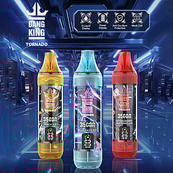 Three Bang King Tornado disposable vape devices in yellow peach ice, blue blue razz ice, and red strawberry watermelon flavors displayed against a futuristic blue corridor background with icons highlighting E-liquid display, power display, anti-dry-burn protection, and mesh coil features.