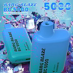 Two blue Bang Blaze BC 5000 disposable vape devices with a blueberry ice flavor, surrounded by blueberries, ice cubes, and purple liquid droplets, highlighting 5000 puffs and 600mAh battery capacity.