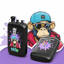 Cartoon monkey in a blue cap and sunglasses stands beside two black vape devices with purple splash graphics and flavor labels including 140K and Triple Flavor.