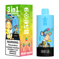 Blue Bang King vape device with pineapple ice flavor featuring a monkey character wearing a colorful mohawk and suit, shown next to its green and yellow gradient packaging with warnings, 3 adjustable flavors, and smart screen indicator.