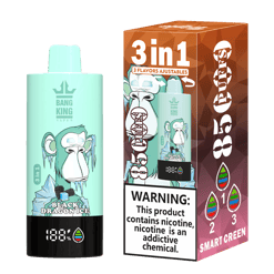 Mint green vape device with illustration of an icy monkey and text 'Black Dragon Ice', next to its brown and purple packaging box showing the same image, labeled '3 in 1', '85 Puffs', and nicotine warning.
