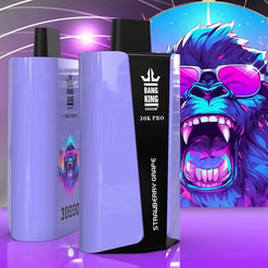 Two lavender-colored disposable vape devices displaying the brand Bang King, model 30K Pro, and flavor Strawberry Grape, with a vibrant illustration of a roaring gorilla wearing pink sunglasses in the background.