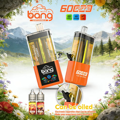 Two orange disposable vape pens with transparent tanks labeled Watermelon Cherry and Cherry Coke in a scenic mountain meadow.